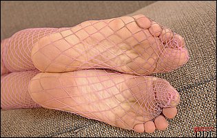 Bambi Stewart in fishnet stockings showing off her hot legs and feet.